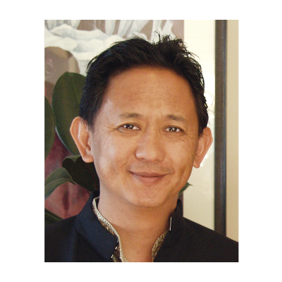 Photograph of a youthful Dzigar Kongtrul Rinpoche in traditional wear